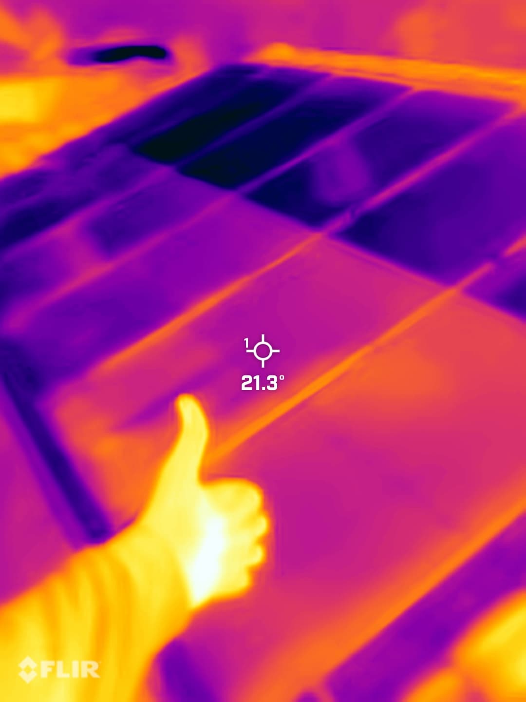 Solar Shine Co thermal photograph with the operator giving a thumbs-up